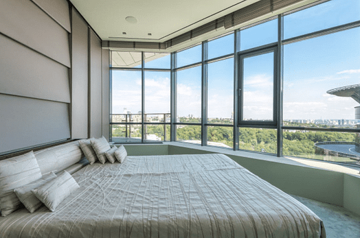 a bedroom with tinted windows